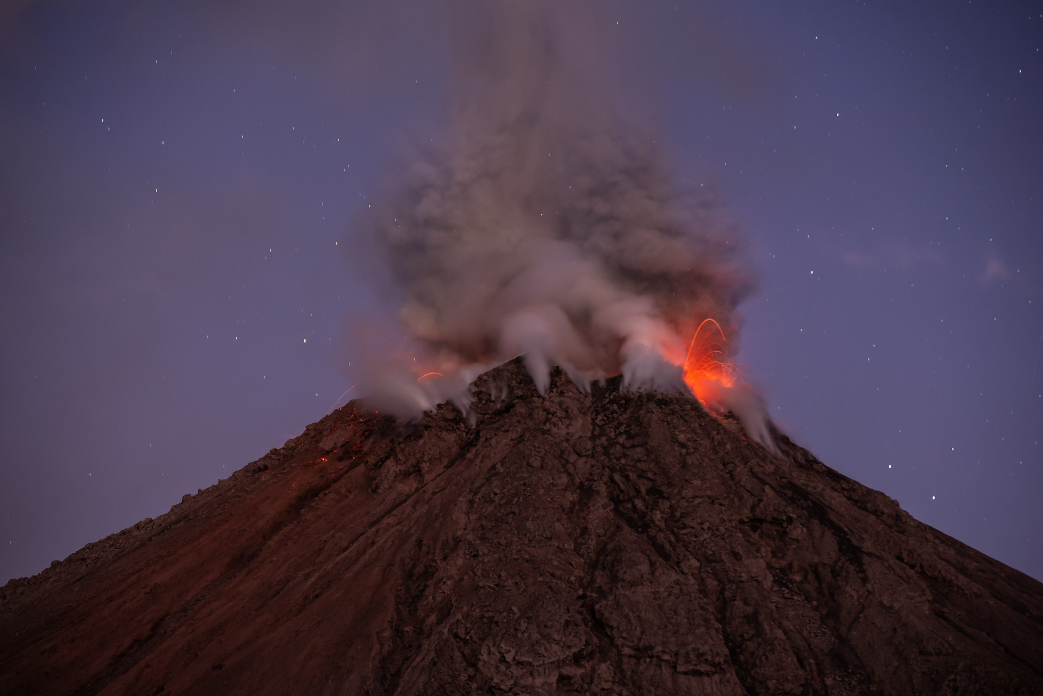 One of our favorite tour moments, with Santiaguito erupting at dawn.