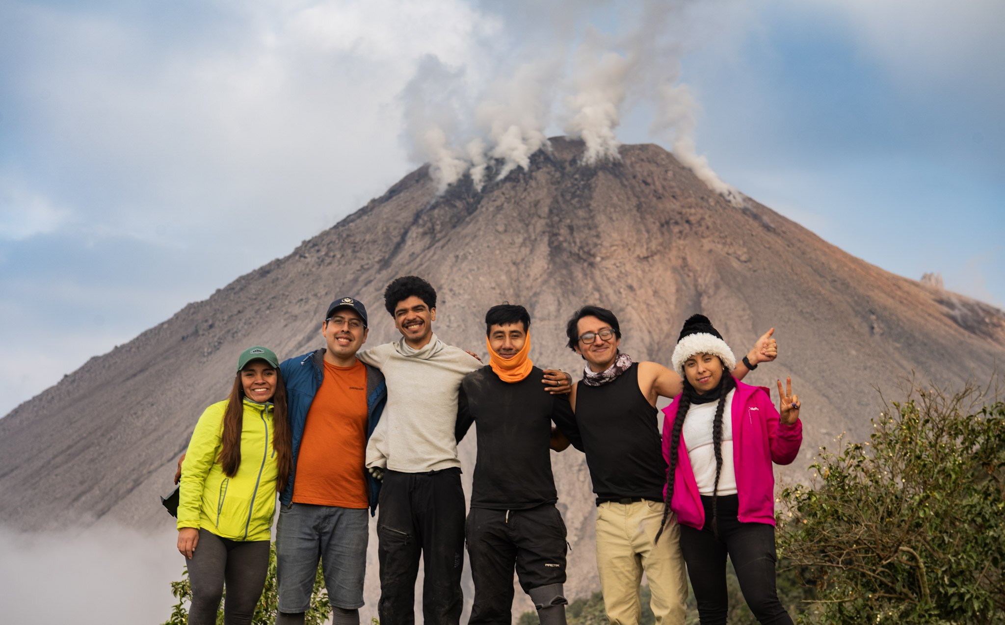 Our group celebrating the climb beneath the immense Caliente dome on our Ruta Secreta hike.