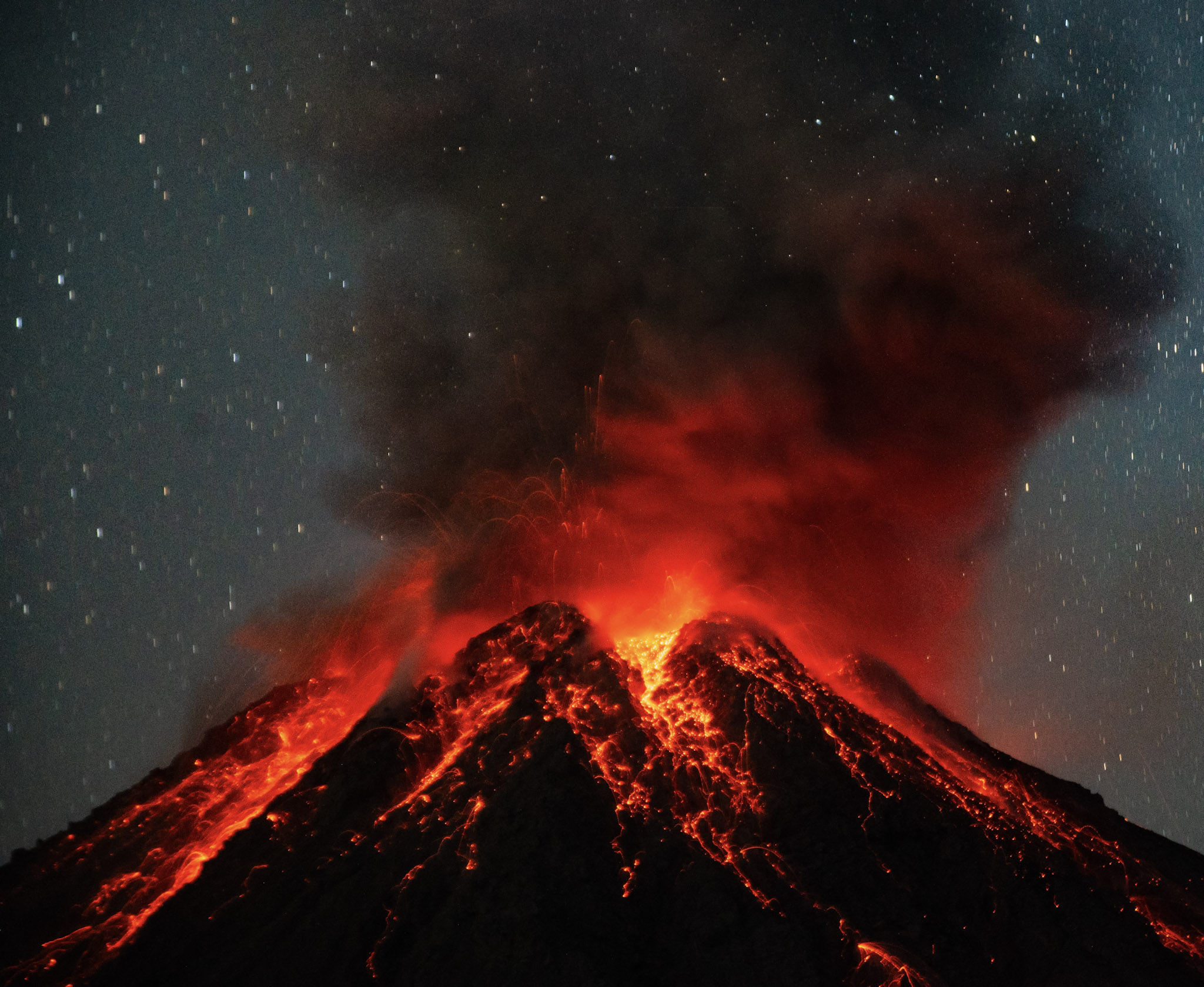 While camping beneath Santiaguito, our group watched this incredible nighttime eruption light up the volcano.